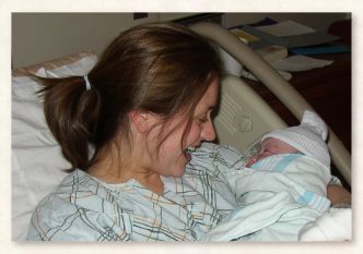 Christi Jones nuzzling newborn Timothy Bryce