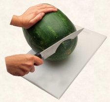 Cut a thin piece off bottom of melon to create flat surface.